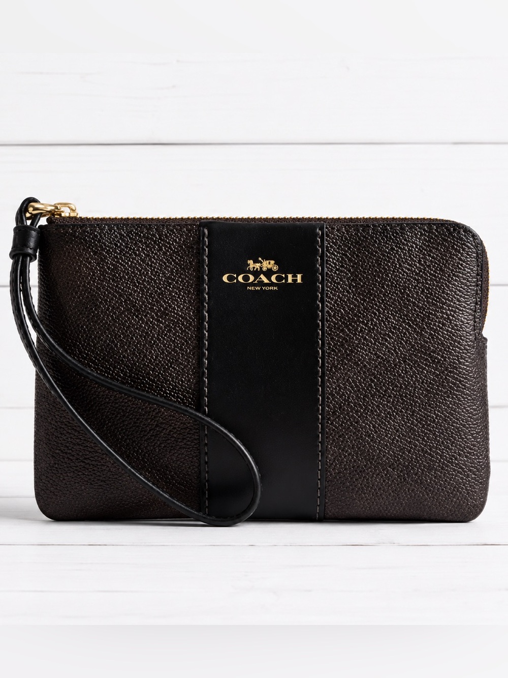 COACH  corner zip wristlet in signature C pattern brown and black